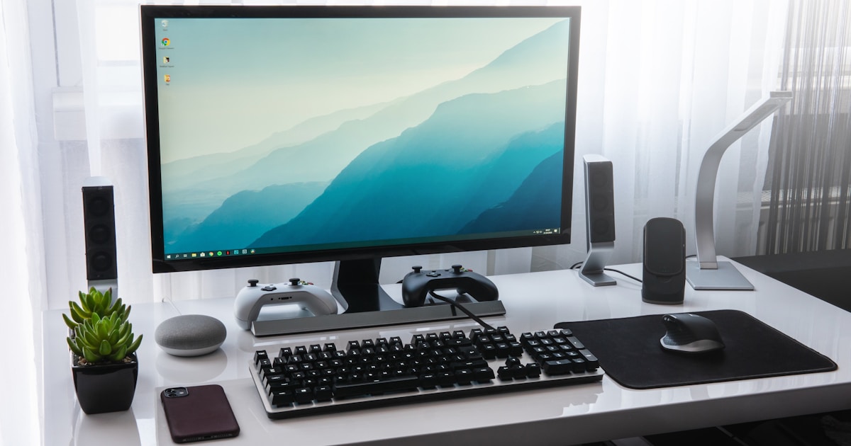 Person using a Windows laptop with a microphone for voice typing